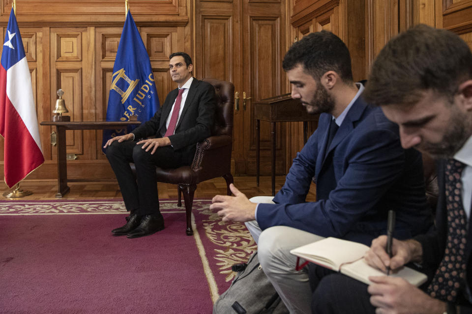 FILE - Paulo Abrao, Executive Secretary of the Inter-American Commission on Human Rights (CIDH), left, meets with Chilean Supreme Court President Haroldo Brito, not in picture, in Santiago, Chile, Nov. 18, 2019. According to an administrative ruling on Oct. 24, 2022 by the Organization of American States' (OAS) top review panel, OAS Secretary General Luis Almagro unfairly maligned the reputation of the Brazilian lawyer who he abruptly fired as the region’s top human rights watchdog. (AP Photo/Esteban Felix, File)