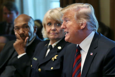 U.S. President Donald Trump criticizes the news media as he hosts a "roundtable discussion on border security and safe communities" in the Cabinet Room of the White House in Washington, U.S., January 11, 2019. REUTERS/Leah Millis