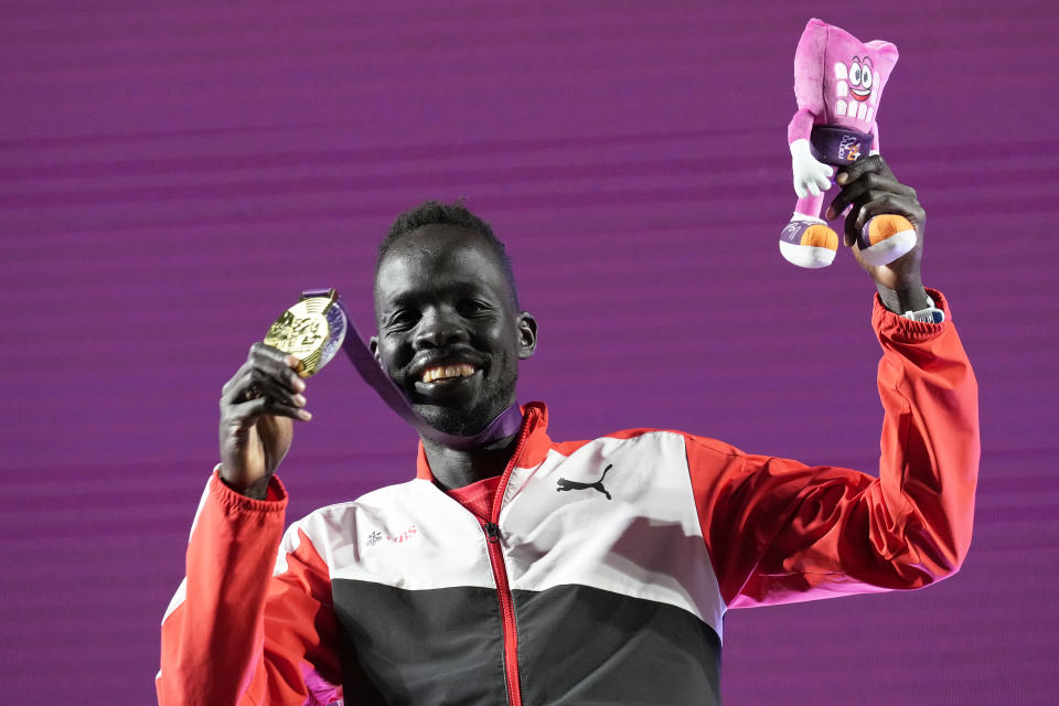 Dominic Lokinyomo Lobalu, of Switzerland, poses on the podium after winning the gold medal in the men's 10000 meters A-race at the European Athletics Championships in Rome, Wednesday, June 12, 2024. (AP Photo/Stefano Costantino)