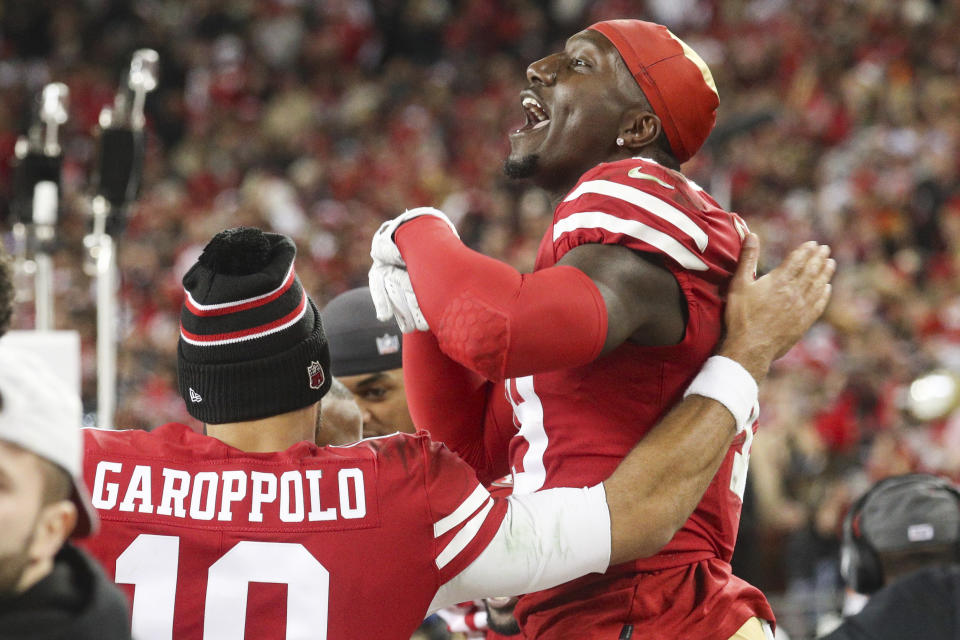 San Francisco 49ers quarterback Jimmy Garoppolo (10) celebrates with wide receiver Deebo Samuel (19) during the NFL NFC Championship football game against the Green Bay Packers, Sunday, Jan. 19, 2020 in Santa Clara, Calif. The 49ers defeated the Packers 37-20. (Margaret Bowles via AP)