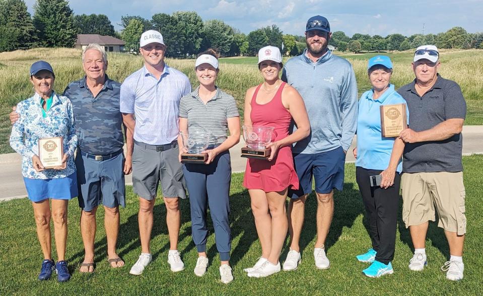 Morgan Johnson and her husband Jordan (third duo from left) of Watertown took second in the South Dakota Golf Association's Husband-Wife Championship that concluded Sunday at the Prairie Green Golf Course in Sioux Falls.  Also pictured are Cindy and Steve Weiland of Yankton (left), 65+ Division champions;  Kelly Evans-Hullinger and Brodie Hullinger of Brookings, overall champions;  and Susan and Rich Mulz of Rapid City, 65+ Division runner-ups.