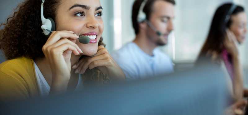 Employees look happy in a call center.