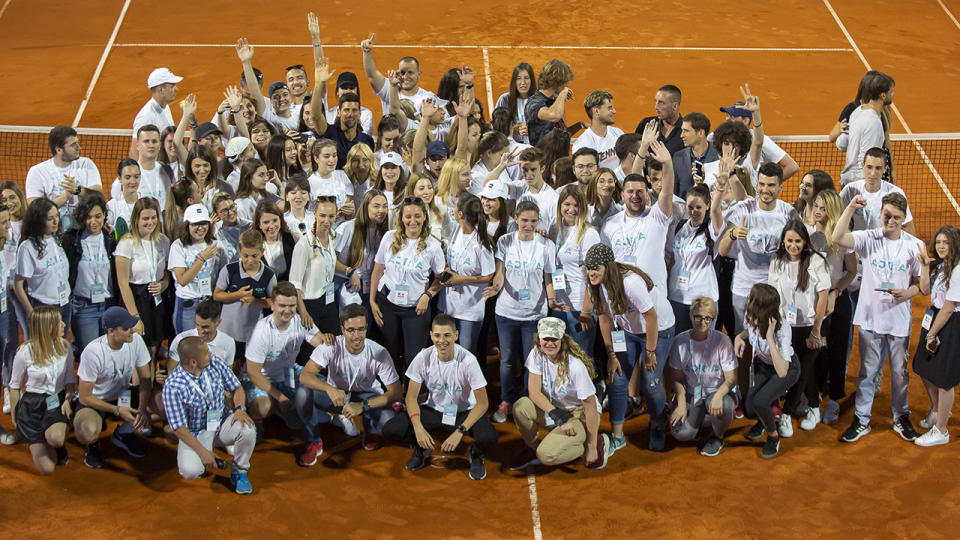 Novak Djokovic, pictured here with tournament volunteers at the end of the Belgrade leg of the Adria Tour.