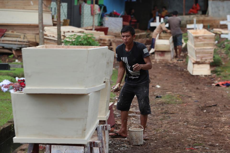 A worker makes a coffin in Jakarta, Indonesia, on April 14.