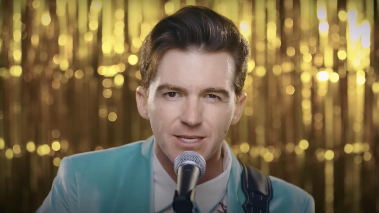  Drake Bell singing in "Going Away" music video 