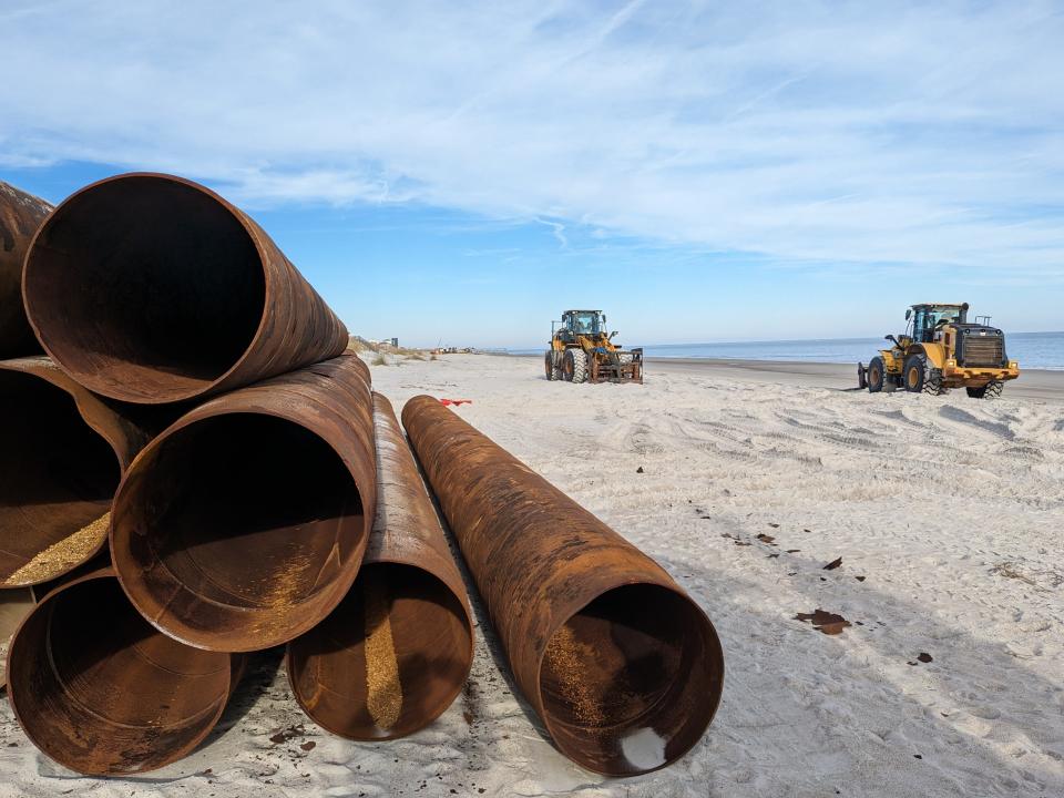 Piping and heavy equipment sits on the beach near the southern end of Topsail Beach in late November.