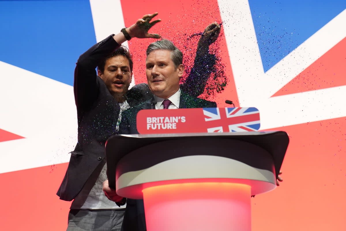 Keir Starmer was covered in glitter during the protest at Labour conference (PA)