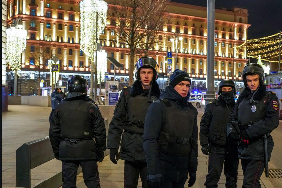 Russian police officers patrol a street next to the FSB security service's office in Moscow on December 19, 2019. Russia's FSB security service said it has "neutralized" at least one gunman.