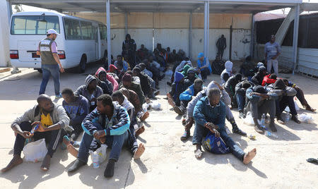 Migrants are seen at a naval base after being rescued by the Libyan coast guard in Tripoli, Libya March 10, 2018. REUTERS/Hani Amara