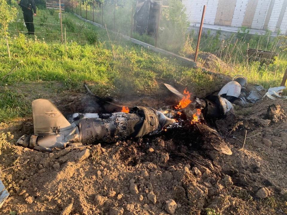 A Russian cruise missile shot down by Ukrainian Air Defence Forces is seen in the backyard of a private house, amid Russia's attack on Ukraine, in Kyiv (via REUTERS)