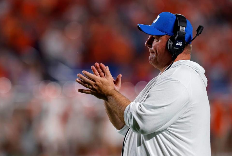 Duke head coach Mike Elko applauds his team during the first half of the Blue Devils’ season opening game against Clemson on Monday, Sept. 4, 2023, at Wallace Wade Stadium in Durham, N.C.