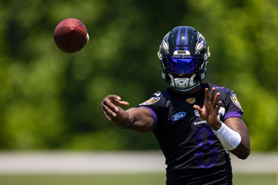 Baltimore Ravens quarterback Lamar Jackson (8) passes the ball during an OTA at Under Armour Performance Center.