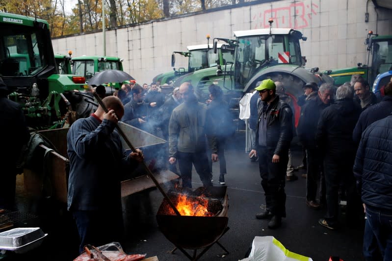 French farmers block the ring road with their tractors during a day of protest in Paris