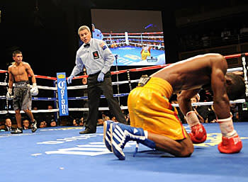 Joseph Agbeko hit the mat after a low blow by Abner Mares