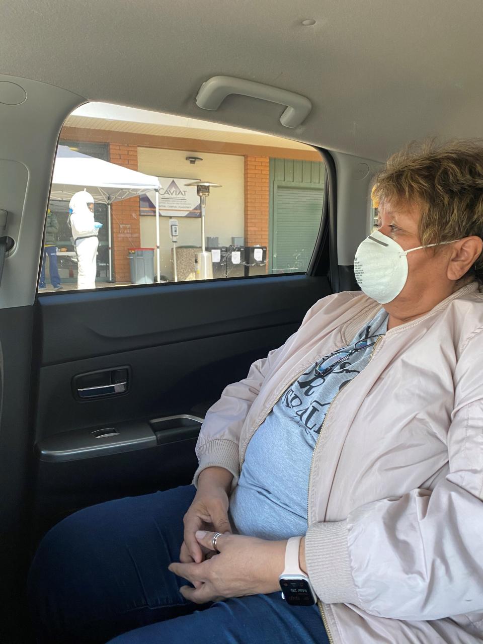 In this March 2020 photo provided by Shannon Todecheene her mother, Carol Todecheene, waits for a coronavirus test in Flagstaff, Ariz. Carol Todecheene was among those severely hit with the virus. (Shannon Todecheene via AP)