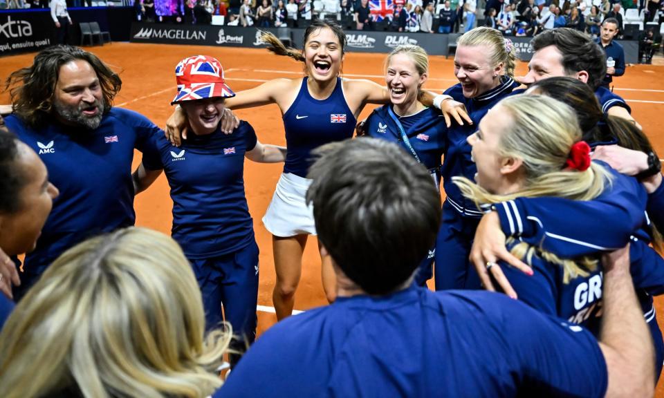 <span>Emma Raducanu is all smiles with the Great Britain team after sealing victory over France.</span><span>Photograph: Aurélien Meunier/Getty Images for ITF</span>