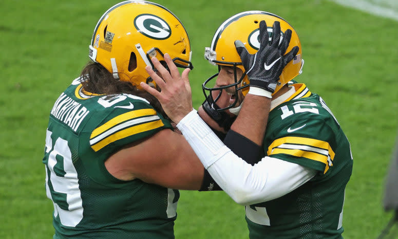 Aaron Rodgers celebrates with Green Bay Packers teammate David Bakhtiari.