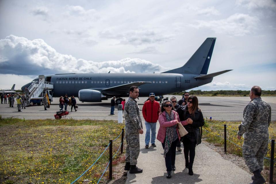 Relatives of the missing passengers arrive at the air force base in Punta Arenas (REUTERS)