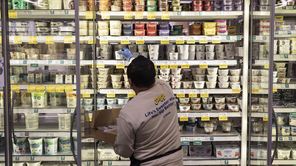 A worker stocks shelves in Washington, DC