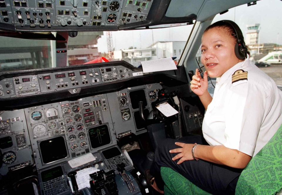 Adine Ossebi, 30, the first and only female pilot for Air Afrique, in the cockpit of a plane at the Abidjan airport in Ivory Coast.