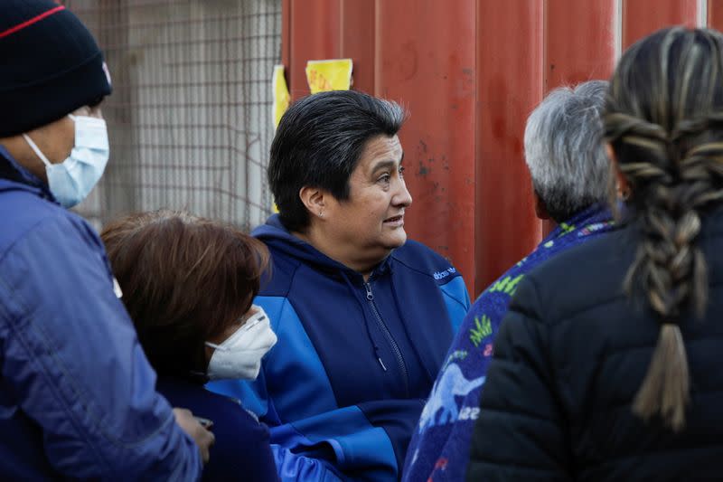 Relatives wait for information outside a hospital after an overpass of the metro partially collapsed in Mexico City