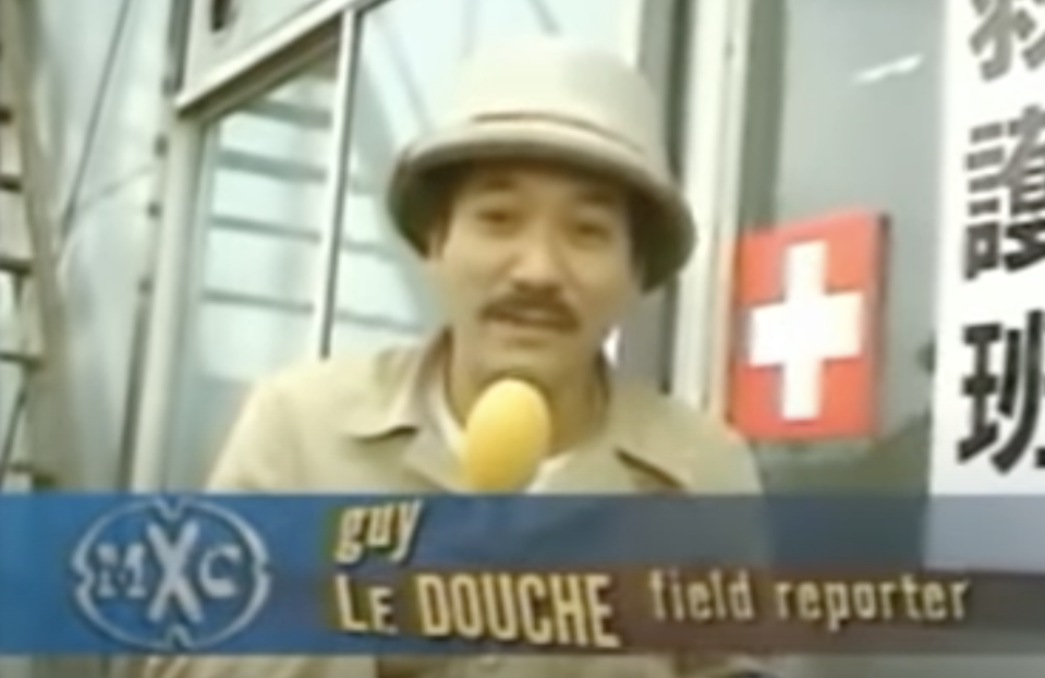 A reporter with the title "guy le douche"