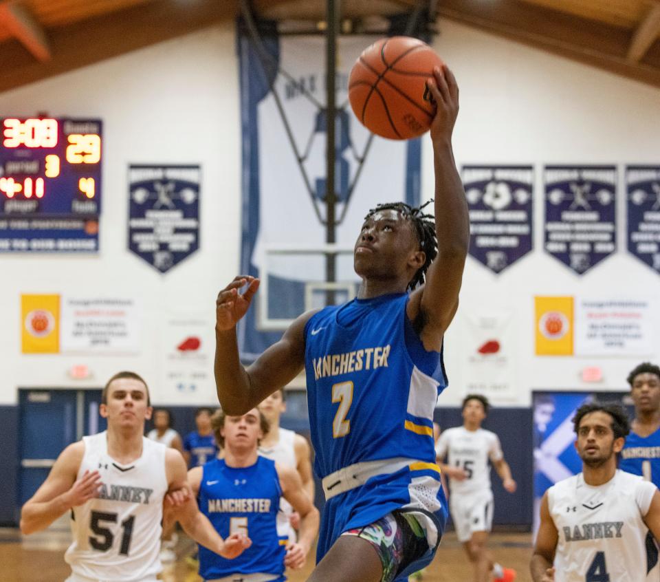 Manchester D'Maari Brown drives to the basket. Ranney Boys Basketball defeats Manchester in Tinton Falls on January 26, 2022. 