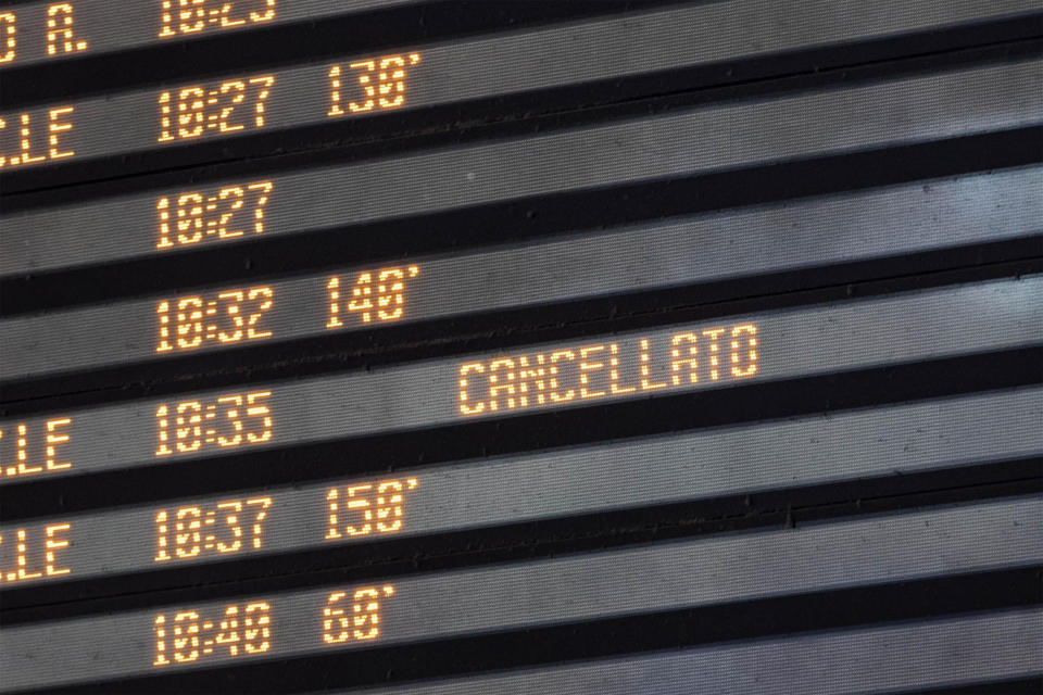 A display board shows delayed and canceled trains at Termini station in Rome, Monday, July 22, 2019. A suspected arson fire has forced cancellations of at least 42 high-speed trains in Italy on the heavily-traveled Milan-Naples corridor. (Massimo Percossi/ANSA via AP)