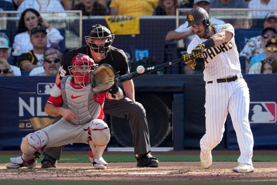 Austin Nola hits an RBI-single during the fifth inning in Game 2 of the NLCS.