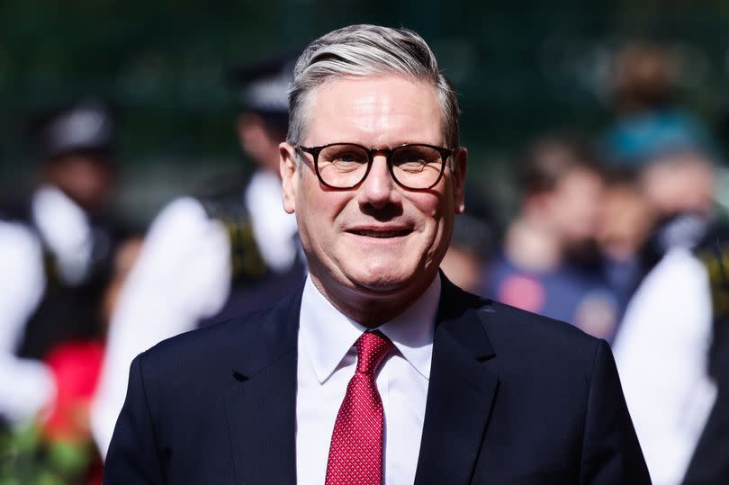 Keir Starmer arrives polling station during general election in London