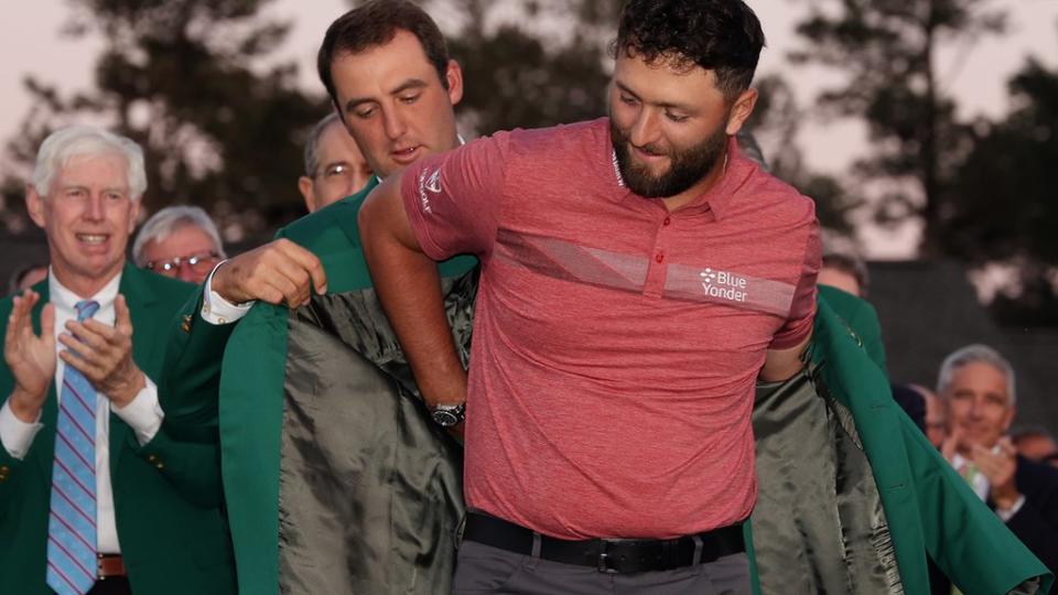 Scottie Scheffler helps Jon Rahm put on the Green Jacket after winning the 2023 Masters