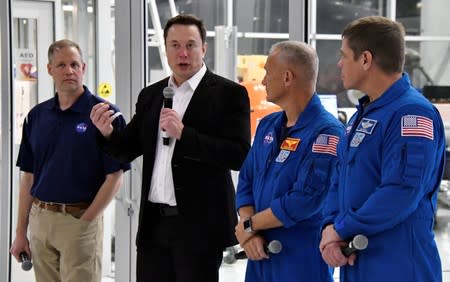 NASA Administrator Jim Bridenstine, SpaceX Chief Engineer Elon Musk, NASA astronauts Doug Hurley and Bob Behnken, take questions from the media after a tour of SpaceX headquarters in Hawthorne