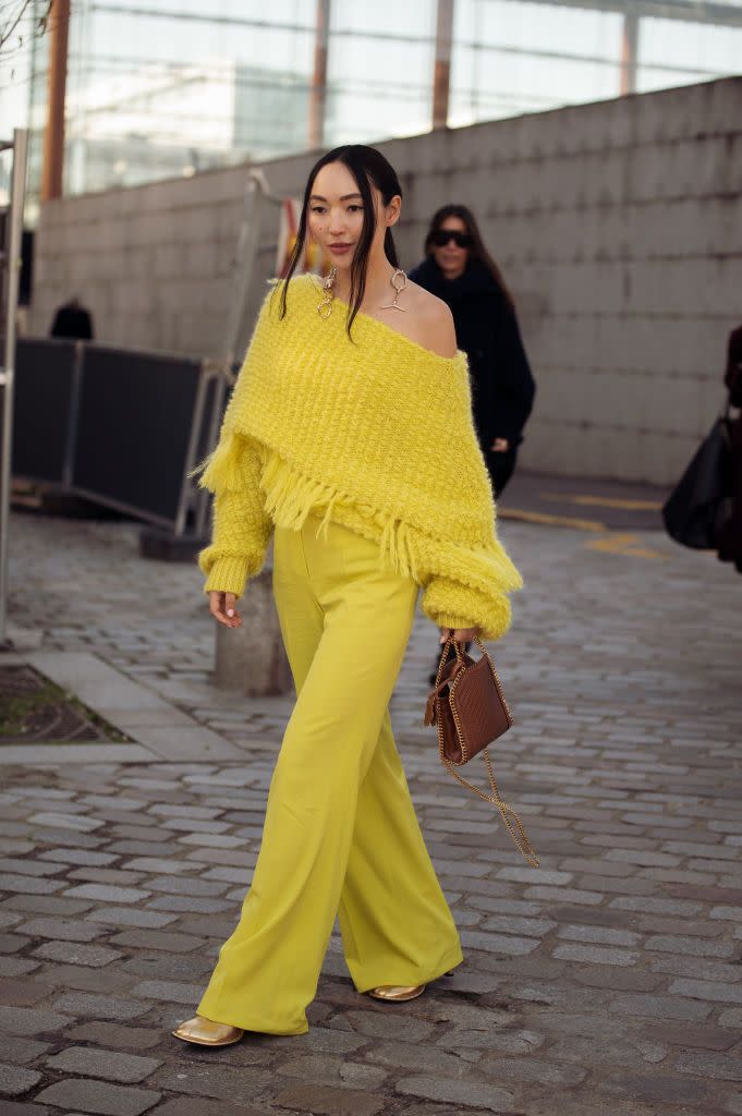 paris, france march 04 korlan madi is seen wearing a yellow fringed knit, pants and a brown bag outside stella mccartney during the womenswear fallwinter 20242025 as part of paris fashion week on march 04, 2024 in paris, france photo by raimonda kulikauskienegetty images