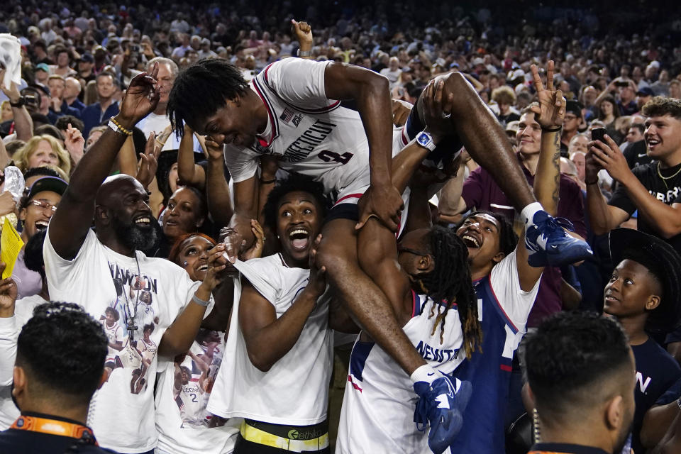 Connecticut guard Tristen Newton celebrates after their win against San Diego State during the men's national championship college basketball game in the NCAA Tournament on Monday, April 3, 2023, in Houston. (AP Photo/Brynn Anderson)