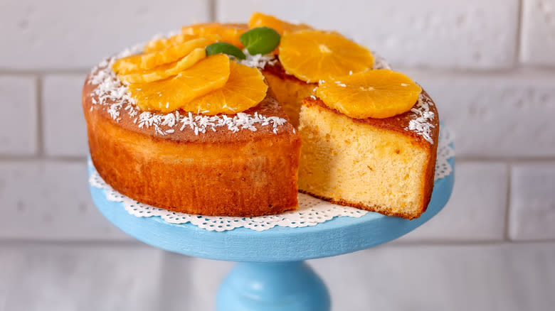 Orange chiffon cake sitting on a platter 