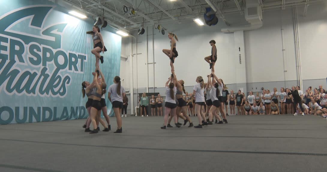 Cheer Sport Sharks Newfoundland cheerleaders show off a routine at the Mount Pearl training facility.  (Jeremy Eaton/CBC - image credit)