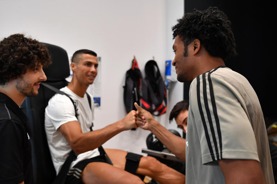 Put it there: Ronaldo greets Juan Cuadrado