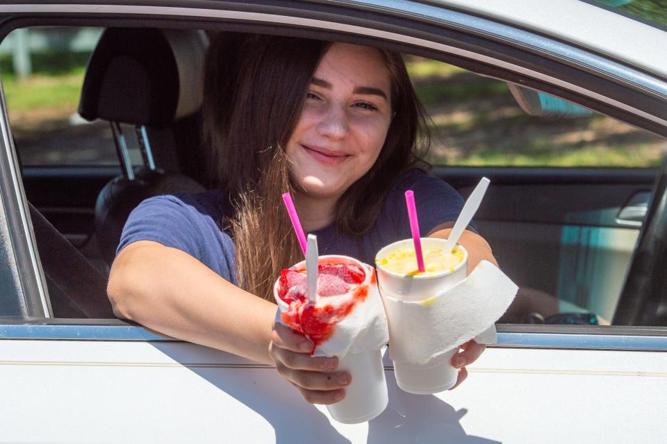 Ava Buford getting sno balls from the Drive thru at Cajun Sno in Lafayatte, LA. Thursday, May 7, 2020.