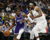 Sacramento Kings guard Terence Davis (3) drives against Oklahoma City Thunder center Derrick Favors (15) during the first half of an NBA basketball game, Friday, Nov. 12, 2021, in Oklahoma City. (AP Photo/Garett Fisbeck)