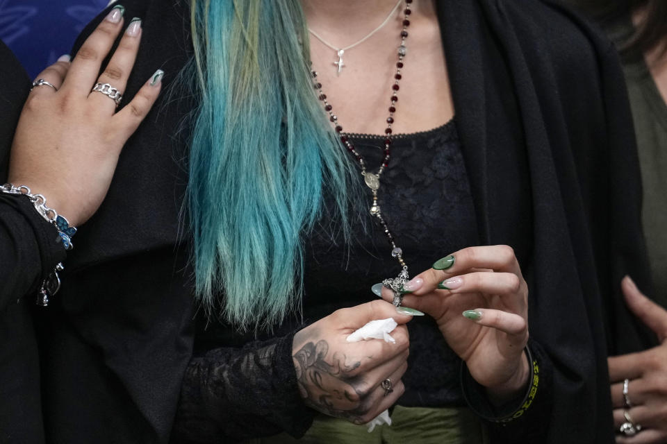 Alexis Nungaray, the mother of Jocelyn Nungaray, holds a rosary after speaking about her daughter during a news conference after Franklin Peña, one of the two men accused of killing the 12-year-old girl, appeared in court, Monday, June 24, 2024, in Houston. Peña was ordered held on $10 million bail as he and another man, Johan Jose Rangel-Martinez, are charged with capital murder over the girl's death. (Brett Coomer/Houston Chronicle via AP)