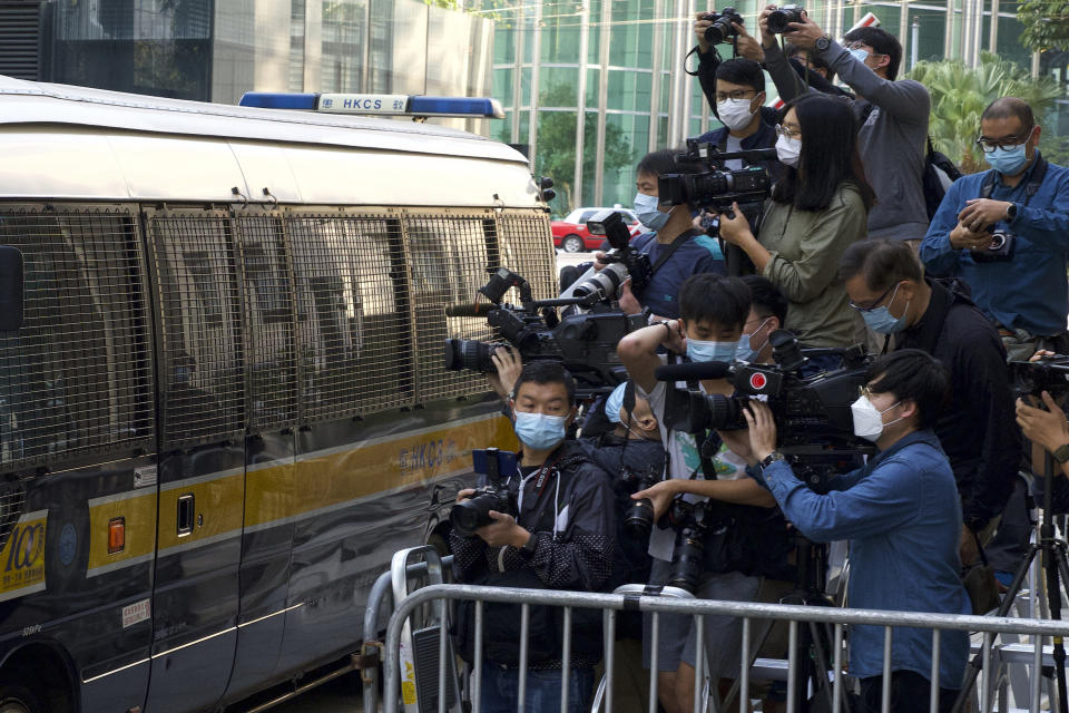 Photographers cover democracy advocate Jimmy Lai arriving at Hong Kong's Court of Final Appeal where the government is arguing against allowing him bail in Hong Kong Monday, Feb. 1, 2021. Lai is charged with "collusion" under the new National Security Law that Beijing imposed on Hong Kong last year. (AP Photo/Vincent Yu)