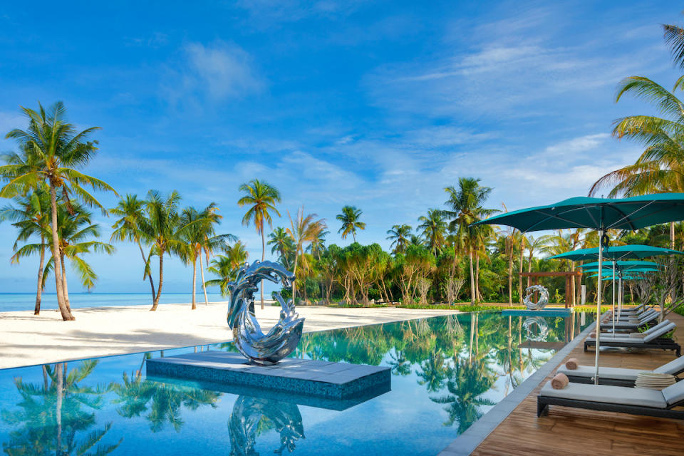 Pool with sculpture at the Pullman hotel in the Maldives