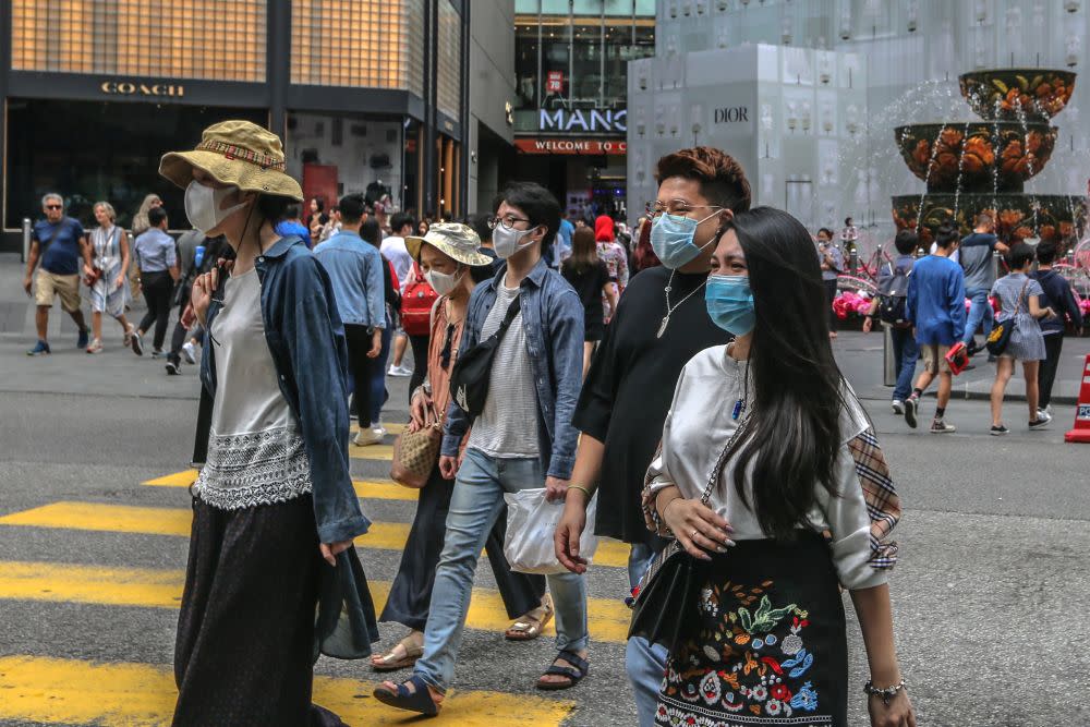 People wearing face masks are pictured outside Pavilion Kuala Lumpur February 10, 2020. — Picture by Firdaus Latif