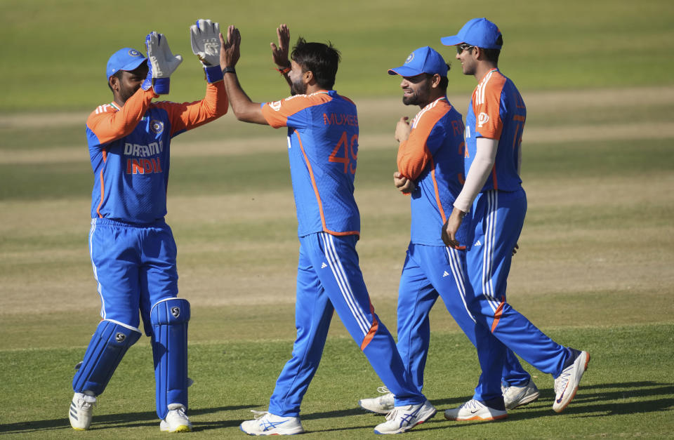 Indian players celebrate a wicket during the T20 cricket match between Zimbabwe and India at the Harare Sports club, in Harare, Sunday, July 14, 2024. (AP Photo/Tsvangirayi Mukwazhi)