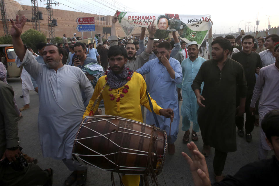 Supporters of Pakistan's former Prime Minister Imran Khan celebrate after Supreme Court decision, in Peshawar, Pakistan, Thursday, May 11, 2023. Pakistan’s Supreme Court has ordered the release of Khan, whose arrest earlier this week sparked a wave of violence across the country by his supporters. (AP Photo/Muhammad Sajjad)