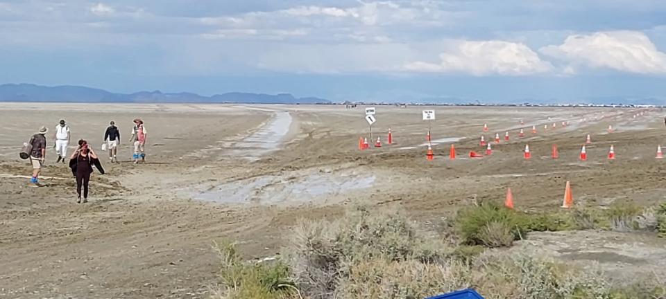 A few festival-goers hike out of Burning Man's mud flats en route to an accessible road on Saturday, Sept. 2, 2023, in Black Rock City, Nev. (Courtesy Sgt. Nathan J. Carmichael / Pershing County Sheriff's Office)