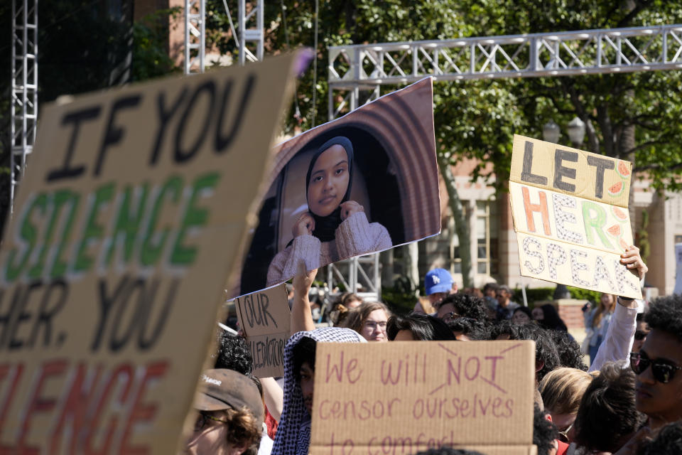 Students hold up a photo of University of Southern California 2024 valedictorian Asna Tabassum in protest to her canceled commencement speech on the campus of University of Southern California on Thursday, April 18, 2024. The University of Southern California canceled the commencement speech by its 2024 valedictorian who has publicly supported Palestinians, citing security concerns, a rare decision that was praised by several pro-Israel groups and lambasted by free speech advocates and the country's largest Muslim civil rights organization. (AP Photo/Damian Dovarganes)