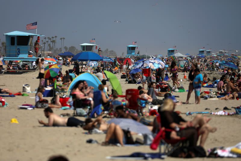 People visit the beach on Memorial Day weekend during the outbreak of the coronavirus disease (COVID-19) in Huntington Beach, California