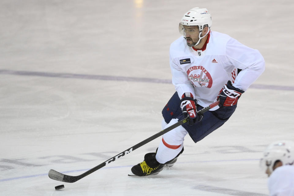 Washington Capitals left wing Alex Ovechkin skates with the puck during practice at the team's NHL hockey training camp, Thursday, Sept. 23, 2021, in Arlington, Va. (AP Photo/Nick Wass)