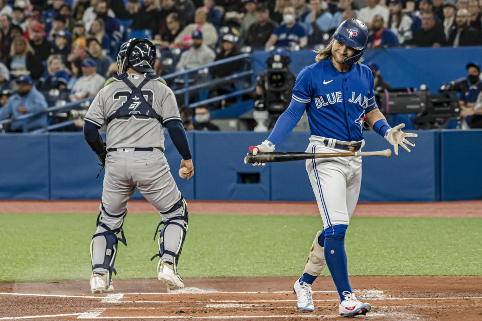 Toronto Blue Jays shortstop Bo Bichette (11) reacts after striking out during the first inning of a baseball game against the New York Yankees, Monday, May 2, 2022 in Toronto. (Christopher Katsarov/The Canadian Press via AP)